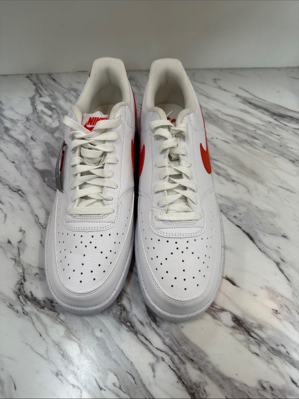 Nike Men’s White Sneakers with Orange Swoosh